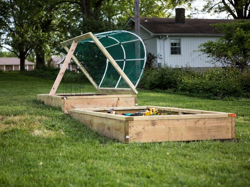 Climate-resilient gardening with healthy vegetables in raised beds under shade cloth