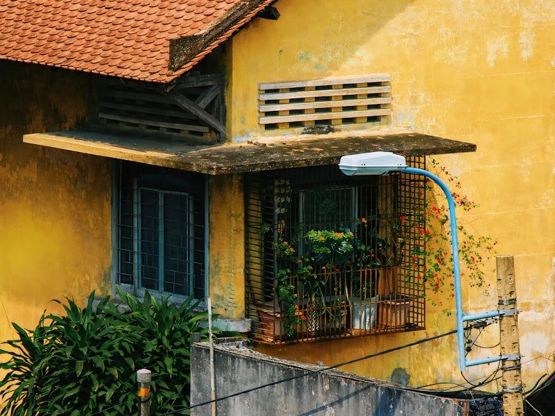 A commercial-grade drip irrigation system installed in a balcony garden with planters and visible drip lines